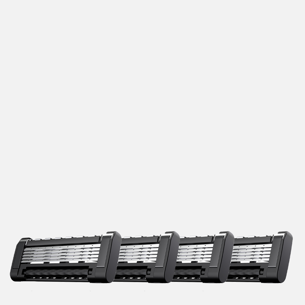 Four razor blade cartridges lined up.