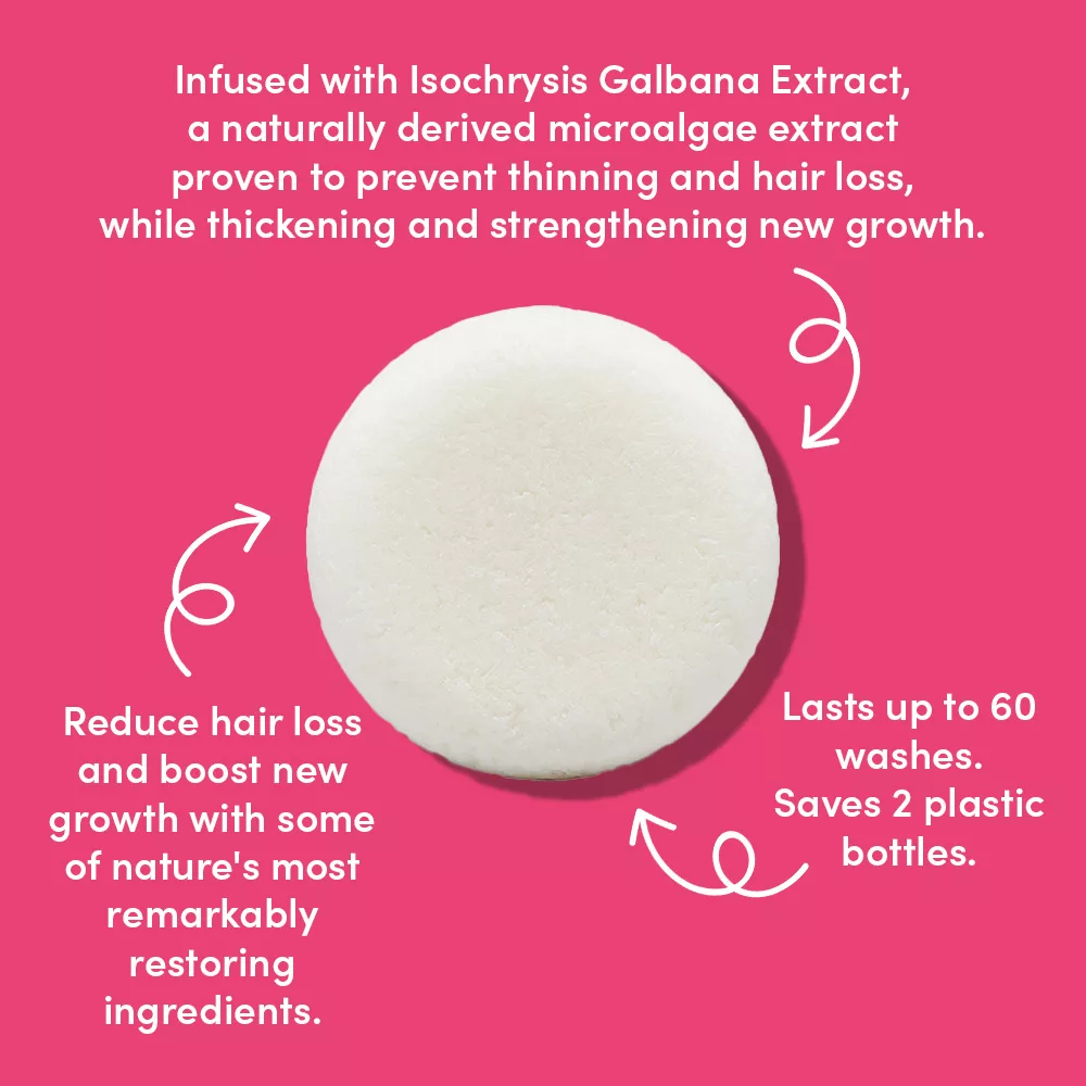 Eco-friendly shampoo bar on pink background.