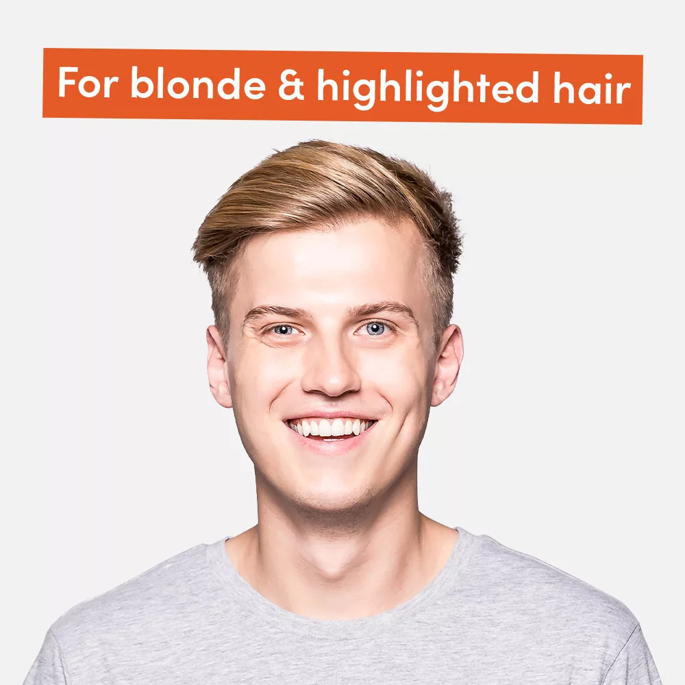 Smiling person with blonde hair.