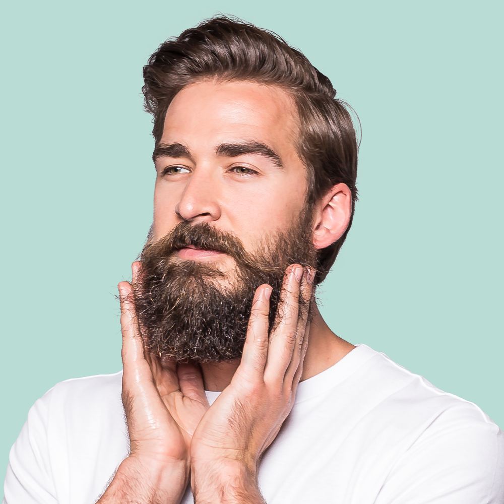 Man with beard touching his chin.