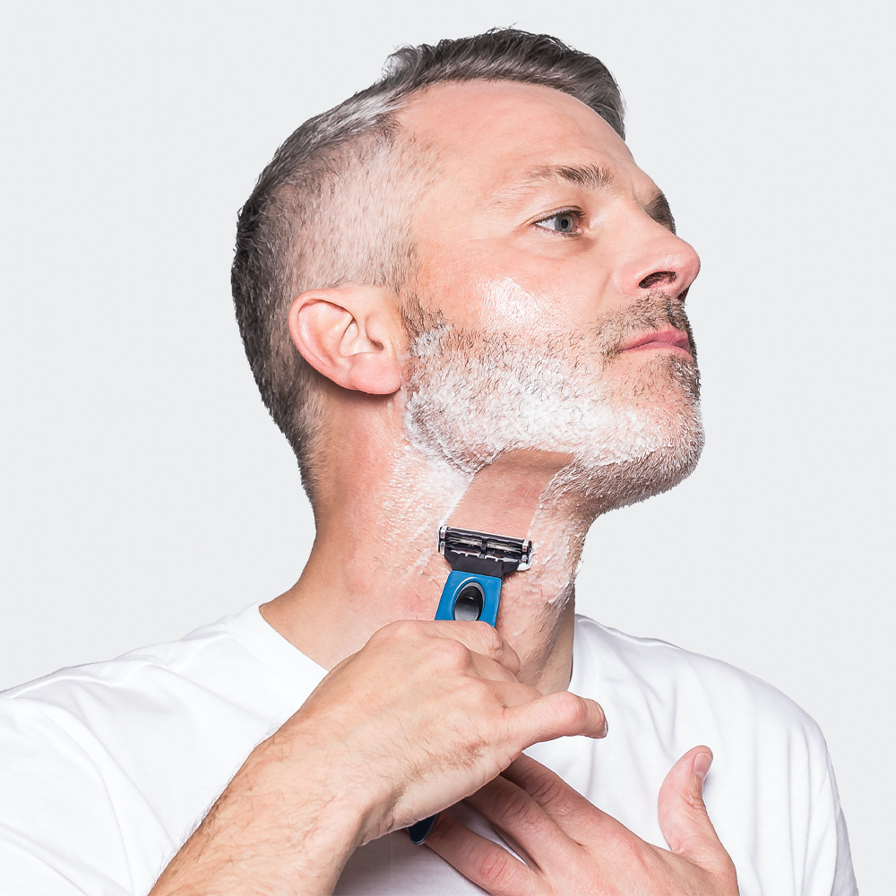 Man shaving with razor