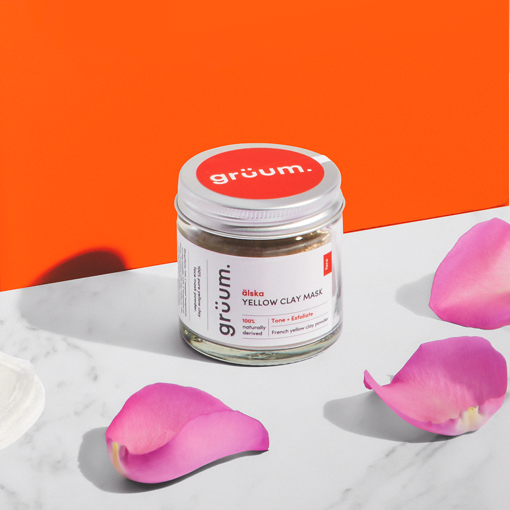 Clay mask jar with pink petals