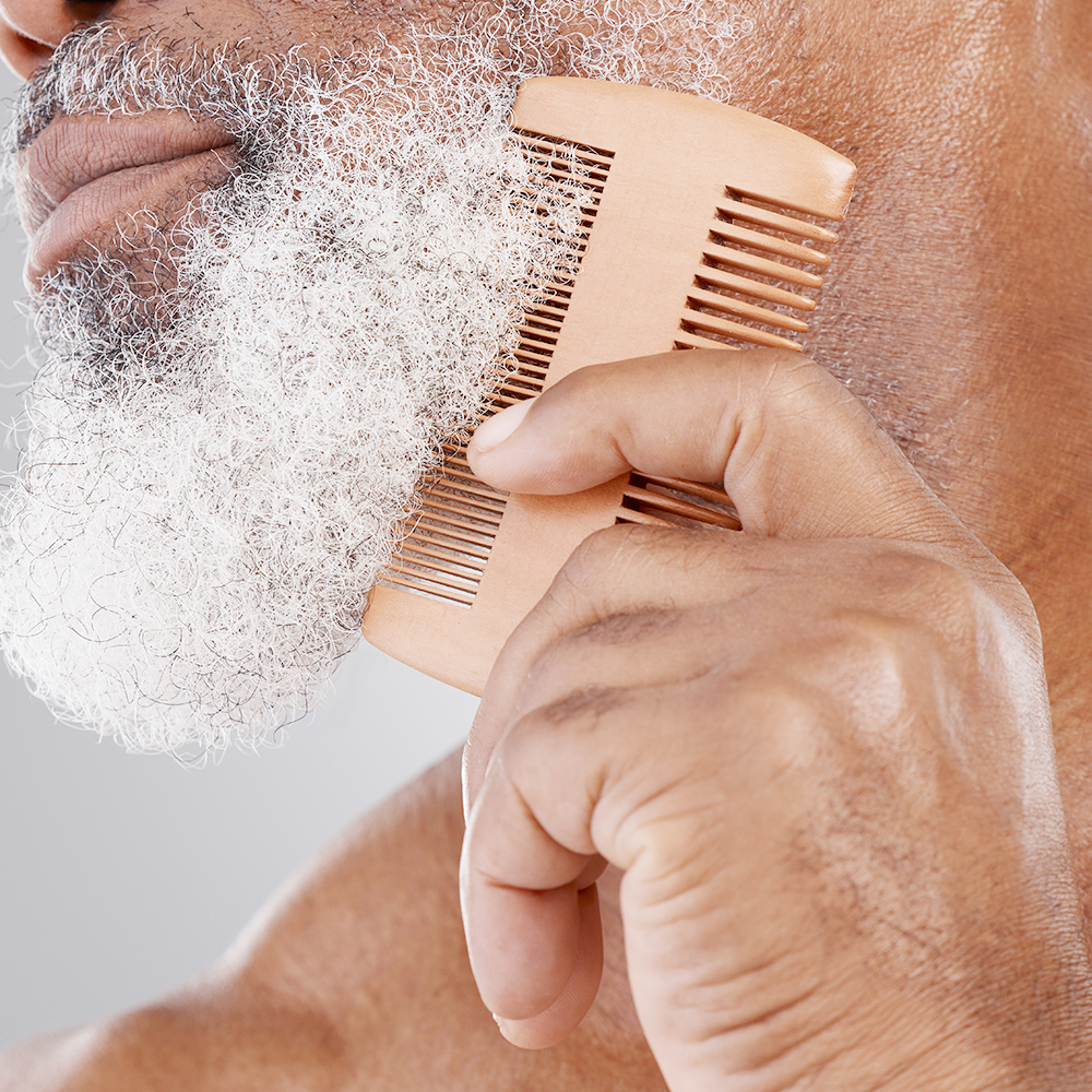 Combing a gray beard