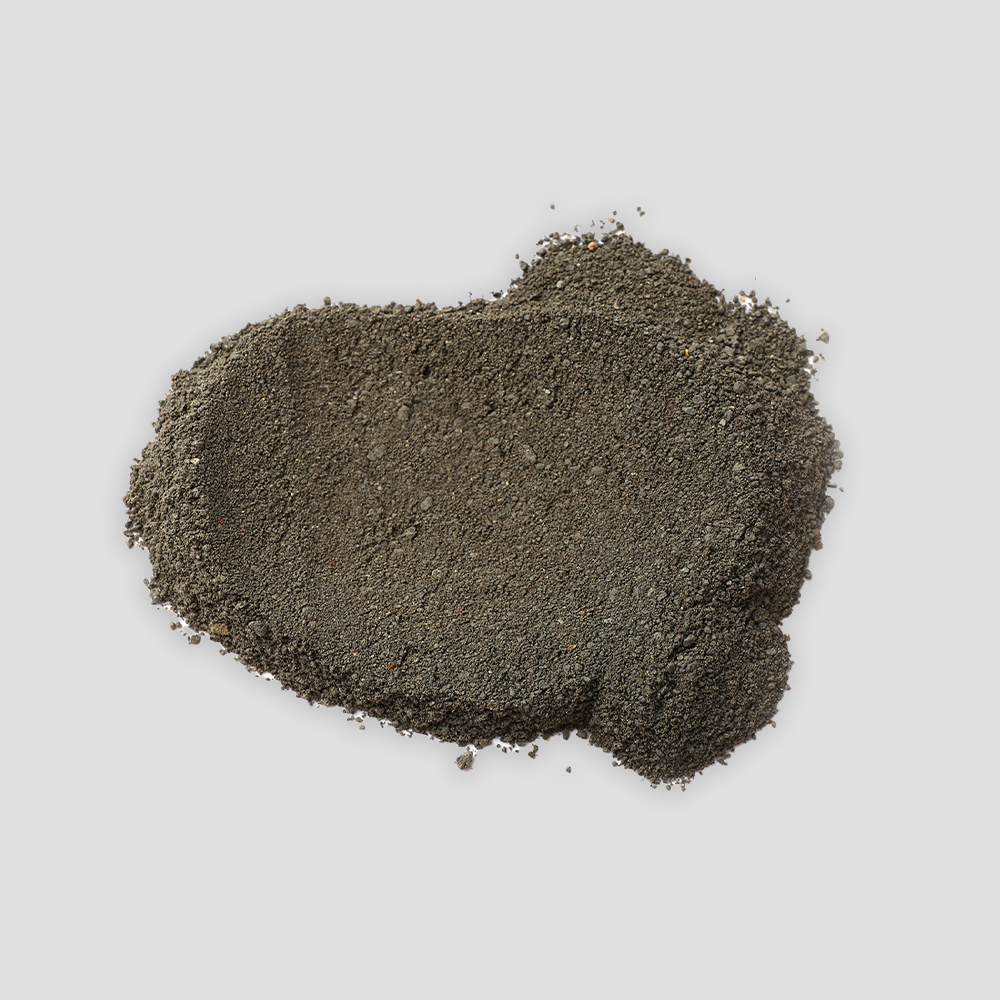 Pile of dark sand on background.