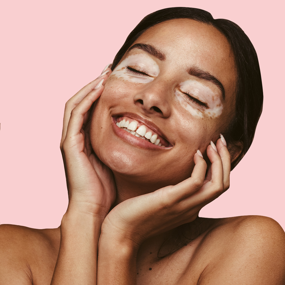 Woman smiling with closed eyes.