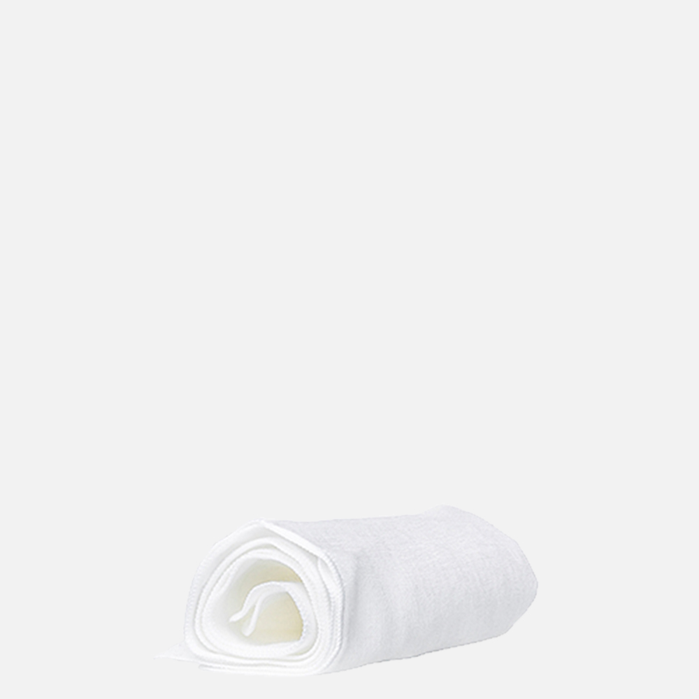 Rolled white towel on gray background.
