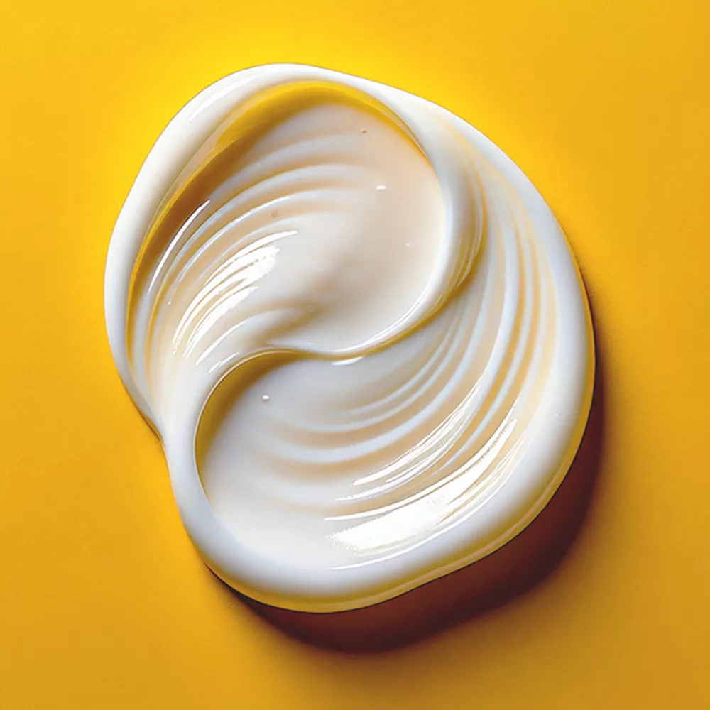 Cream swirl on yellow background