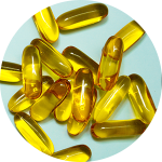 Close-up of yellow capsules on blue background.