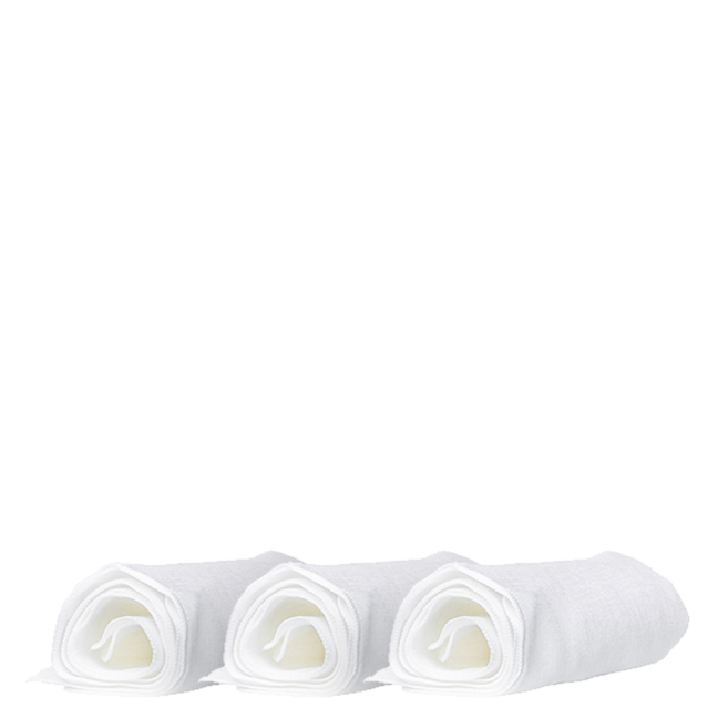 Three rolled white towels