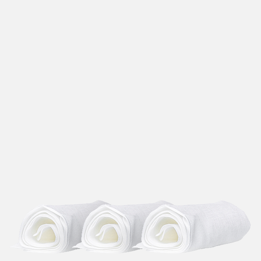Three rolled white towels
