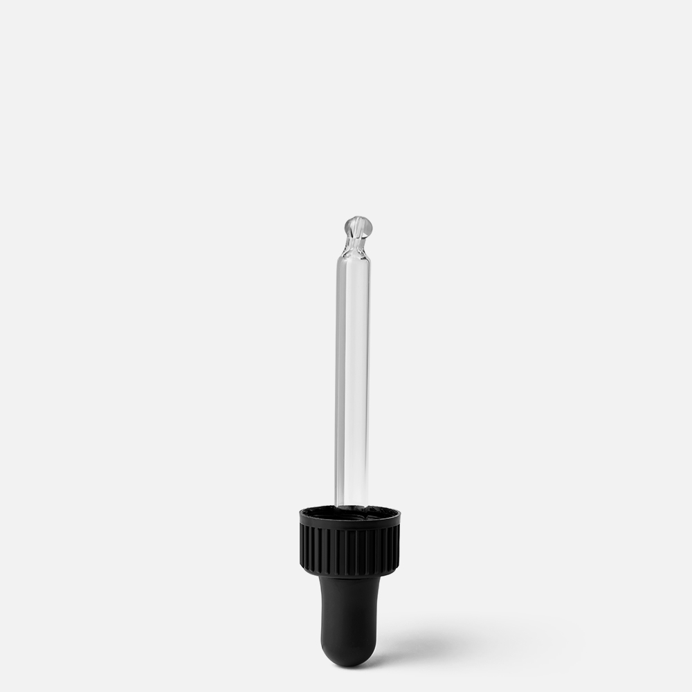 Clear glass dropper on white background.