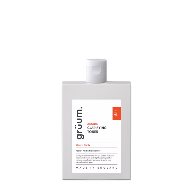 Clarifying toner bottle on black background.