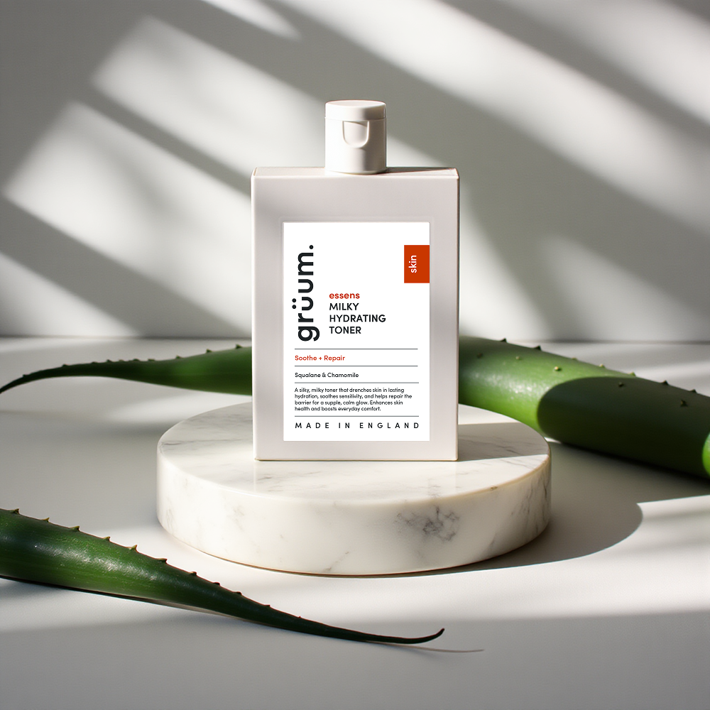 Bottle of hydrating toner on marble stand.