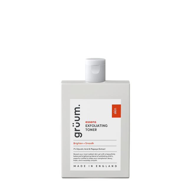 Exfoliating toner bottle on black background.