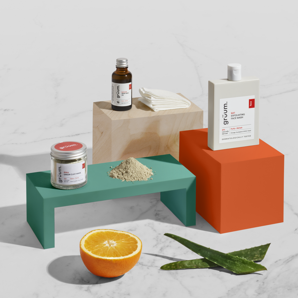 Skincare products with orange and aloe.