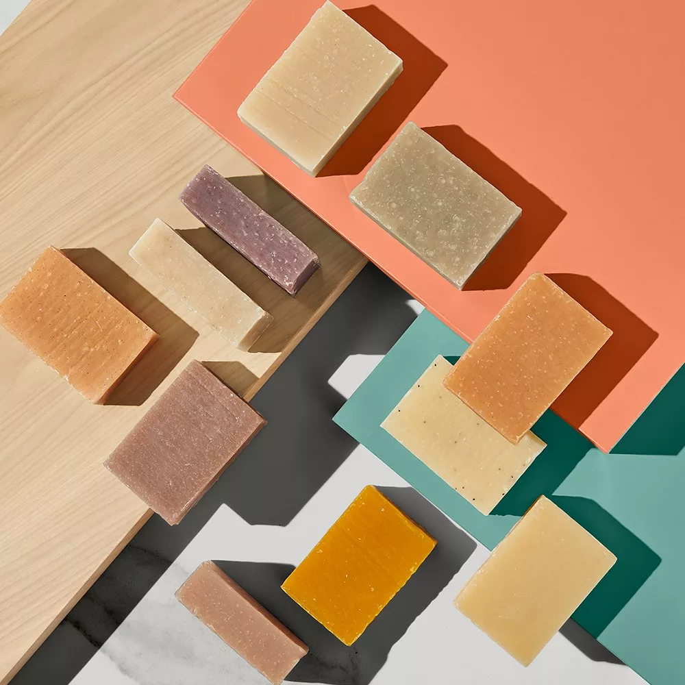 Colorful soap bars on overlapping boards.