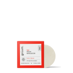 Red boxed facial exfoliator on black background.