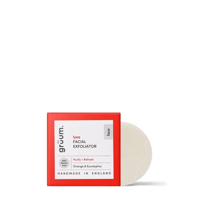 Red boxed facial exfoliator on black background.