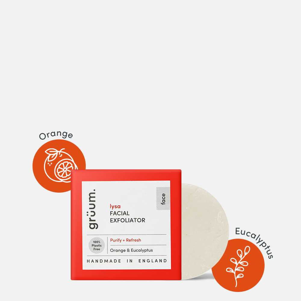 Facial exfoliator with orange and eucalyptus icons.