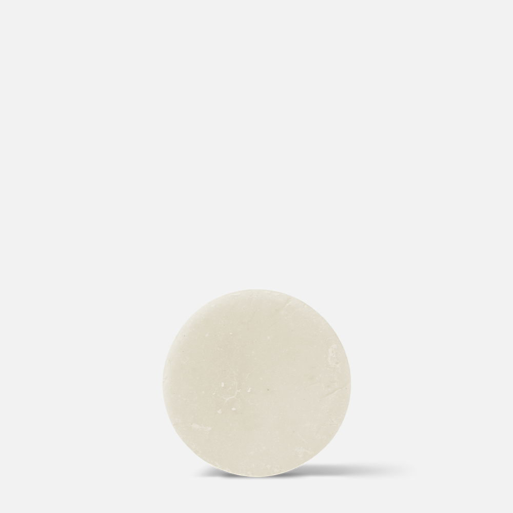 Round beige object on white background.