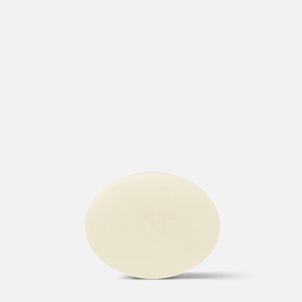 Round yellow object on white background.