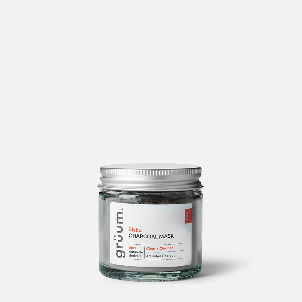 Jar of charcoal mask on white background