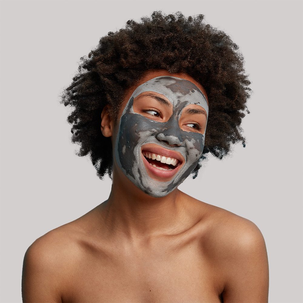 Smiling woman with face mask