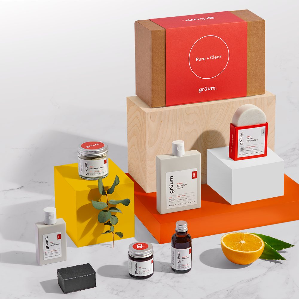 Assorted skincare products on colorful blocks