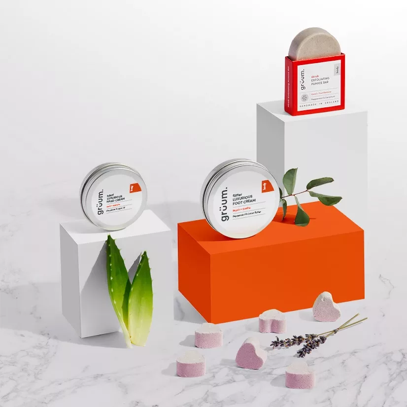 Skincare products with plant leaves display.