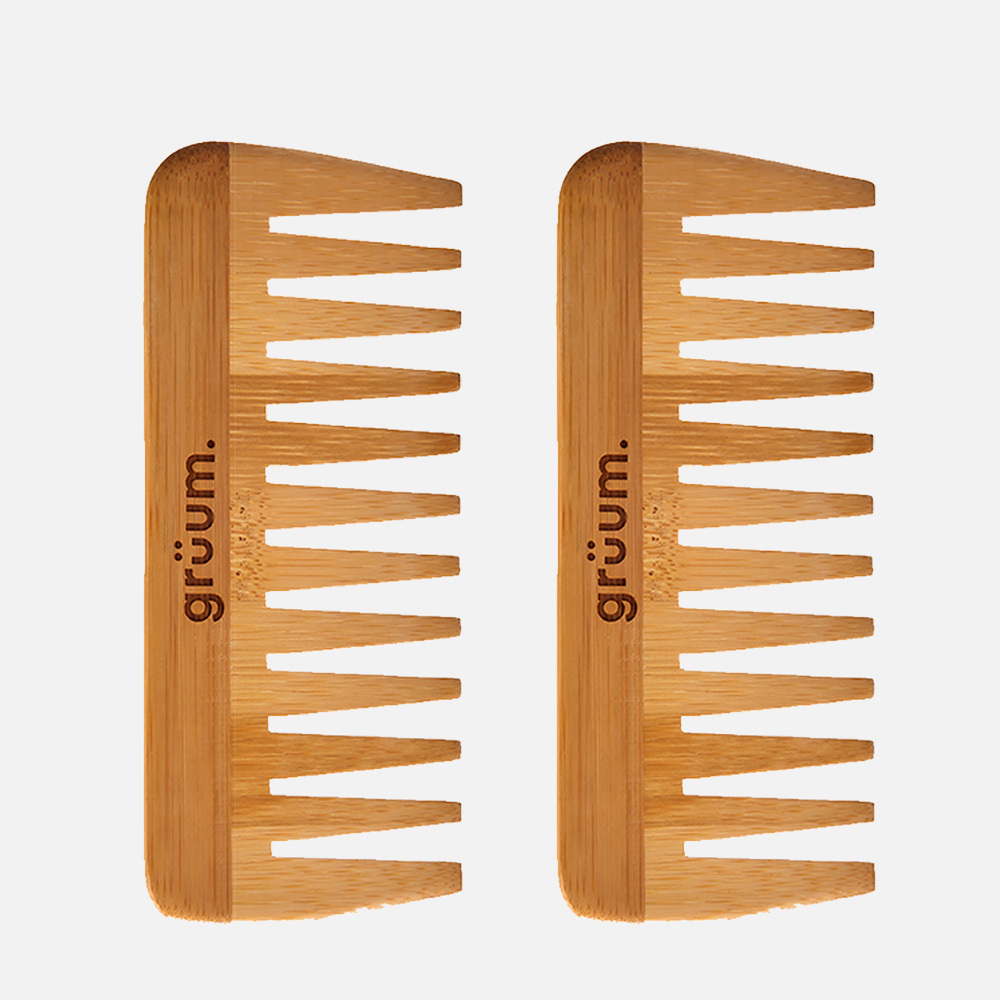 Two wooden combs with branding.