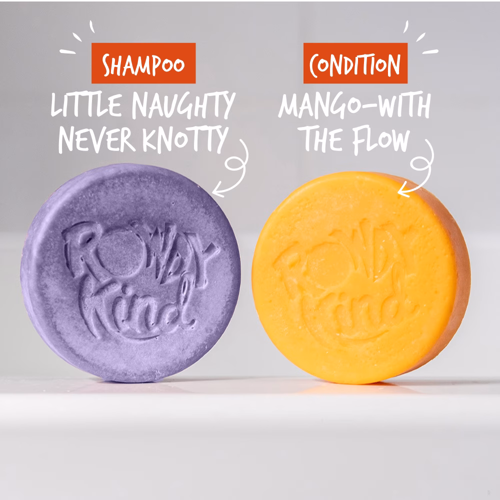 Two round shampoo bars, purple and orange.