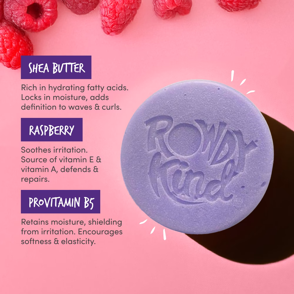 Purple soap with raspberries on pink background.