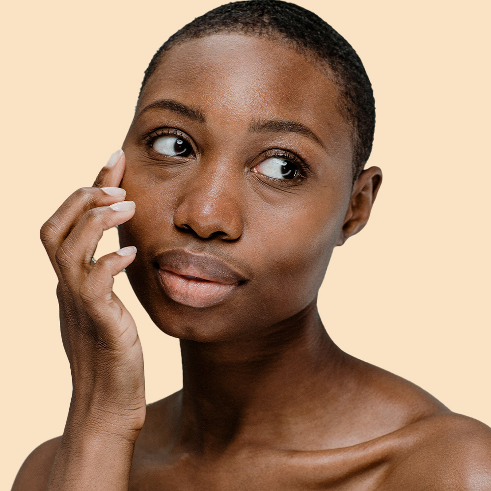 Person touching their cheek