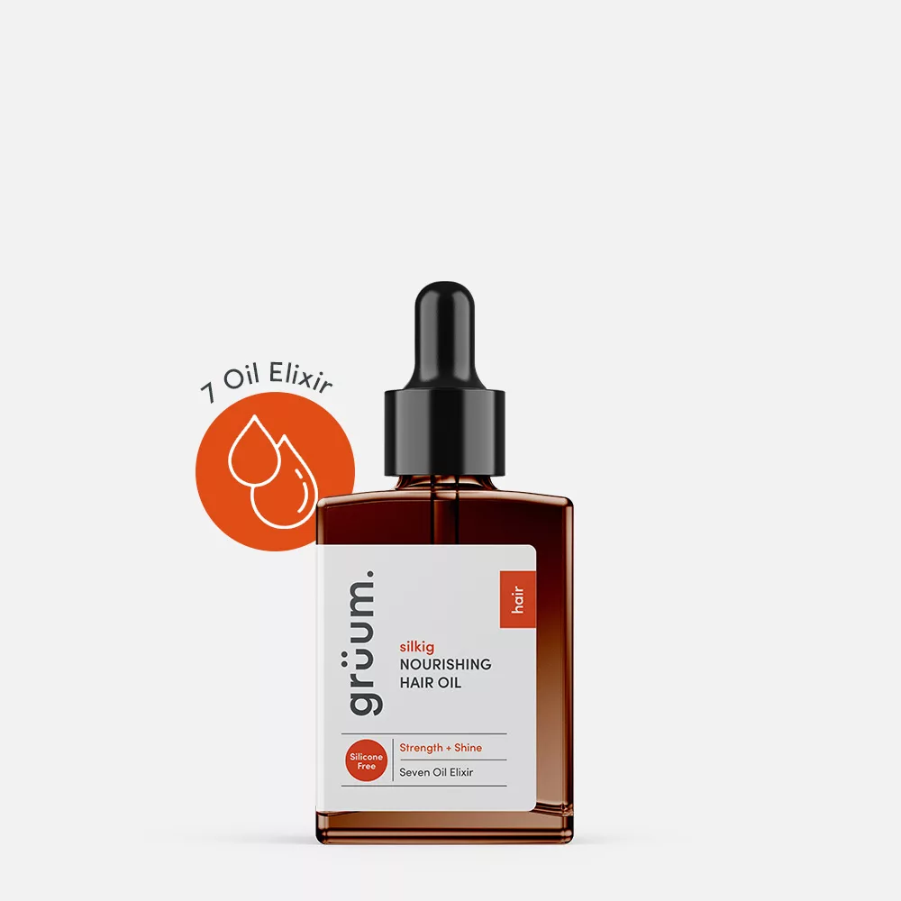 Nourishing hair oil bottle with dropper.