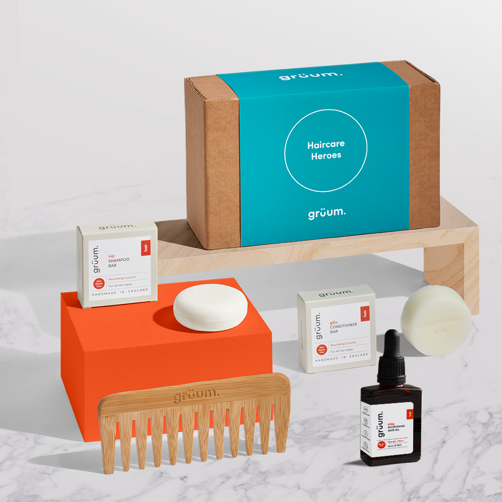 Haircare products display with comb and bottles.