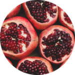 Halved pomegranates with seeds visible.