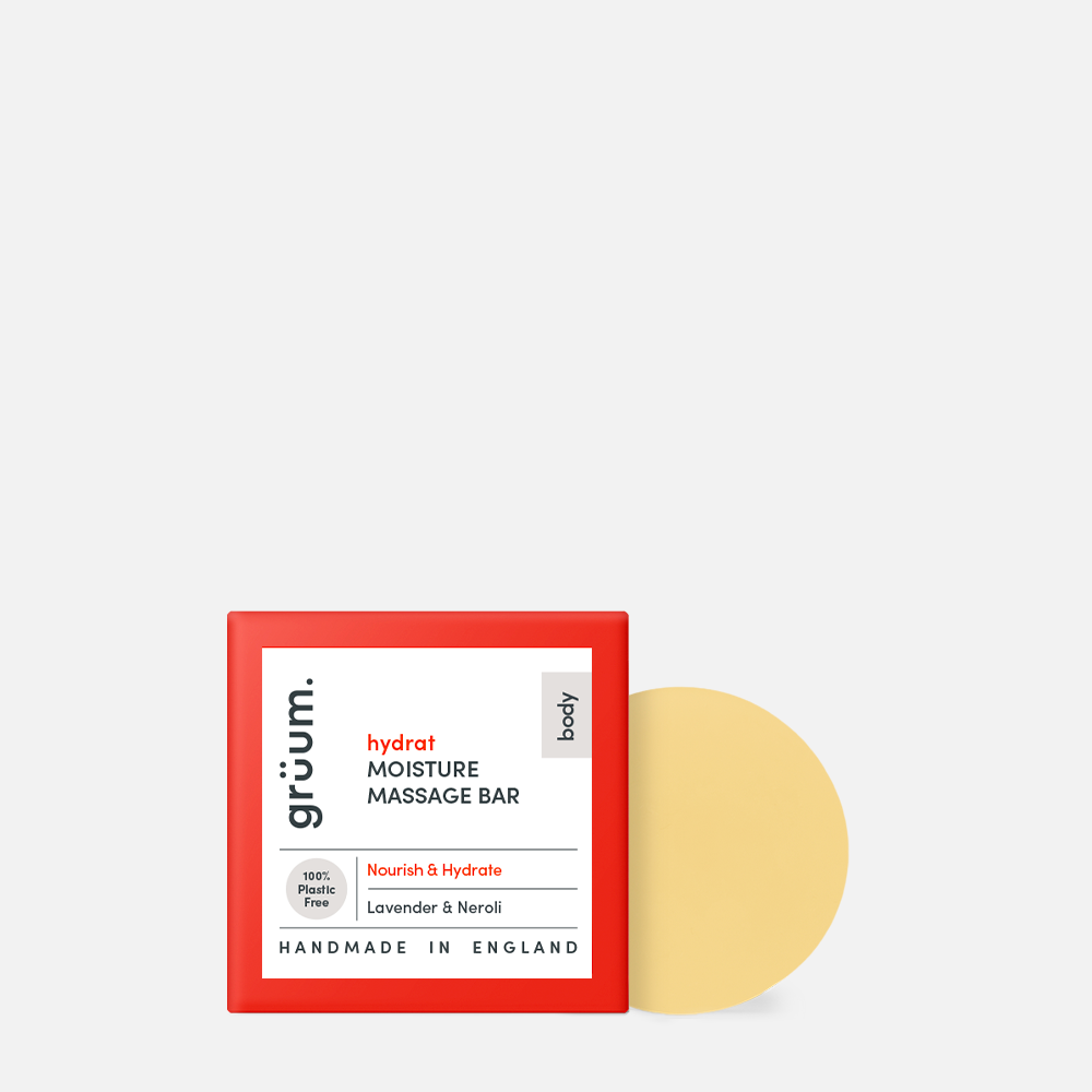 Red box with beige round soap bar.