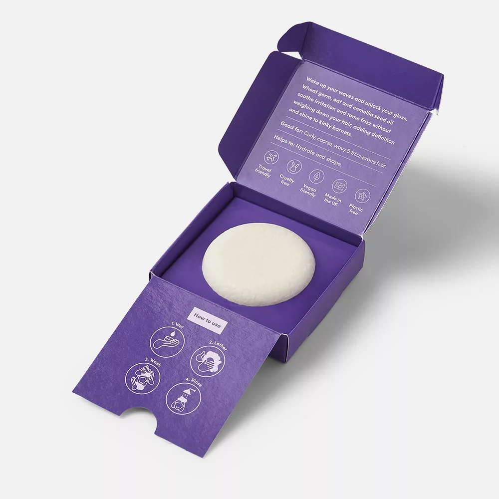 Purple box with white round soap.