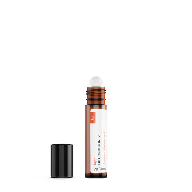 Brown lip conditioner tube with black cap