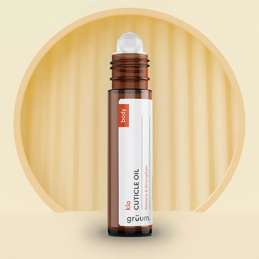 Cuticle oil bottle on stylized background.