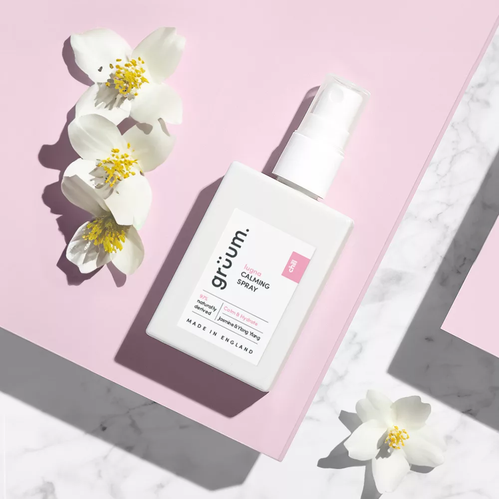 Calming spray bottle on pink background