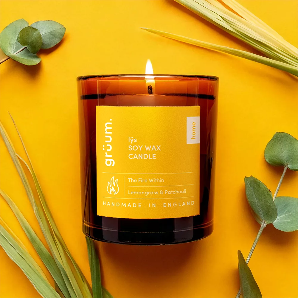 Soy wax candle on yellow background.