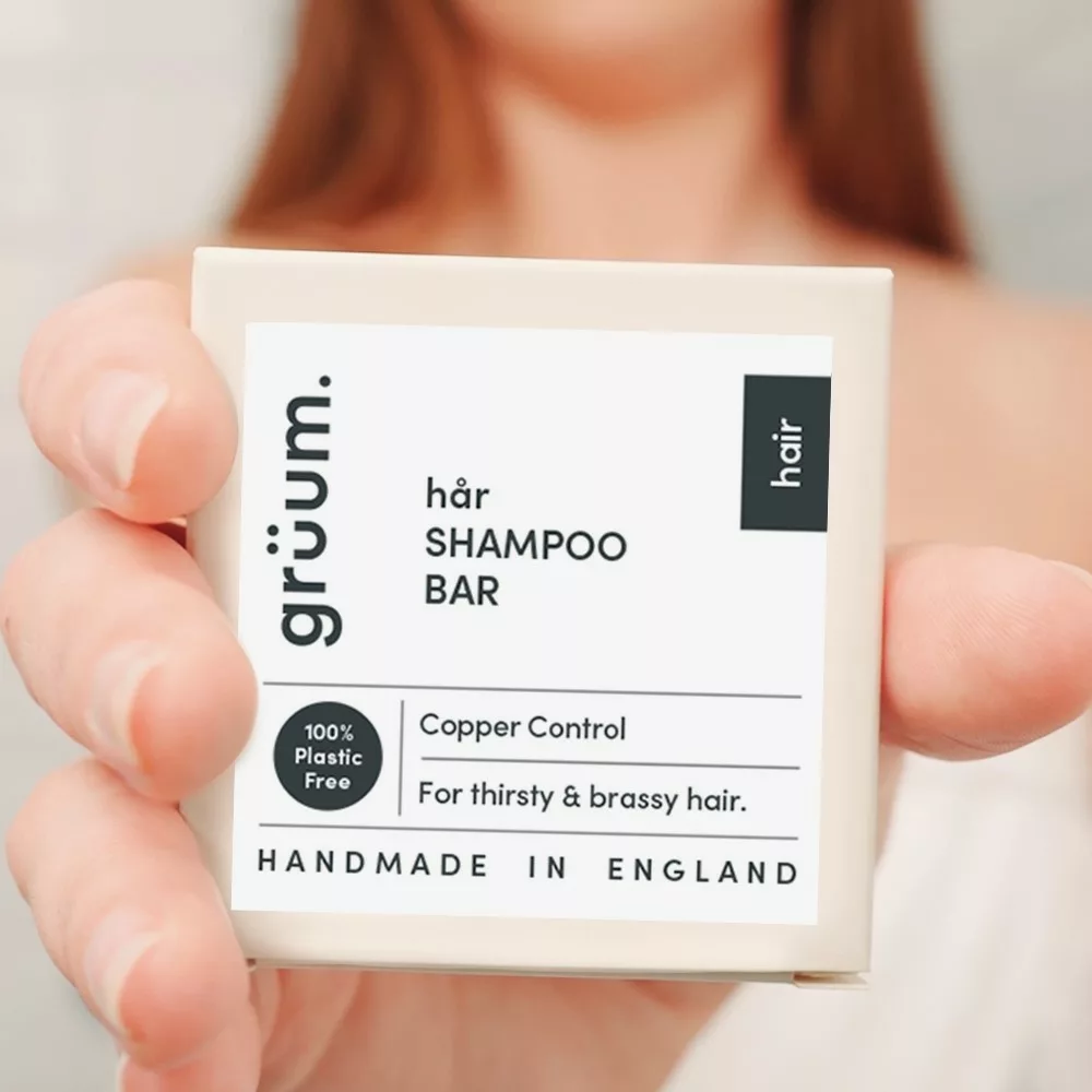Person holding shampoo bar package
