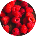 Pile of fresh raspberries on table