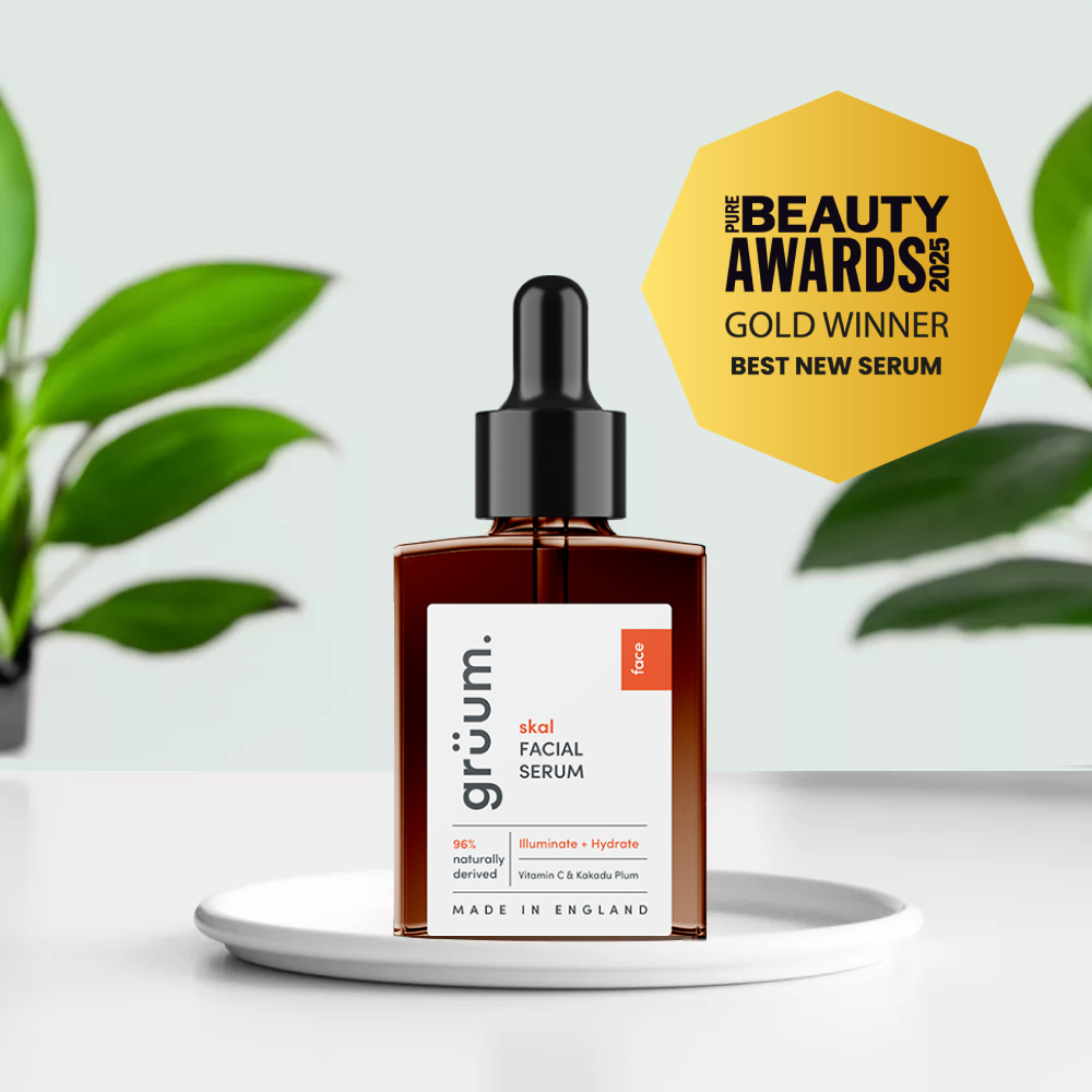 Facial serum bottle with award badge.