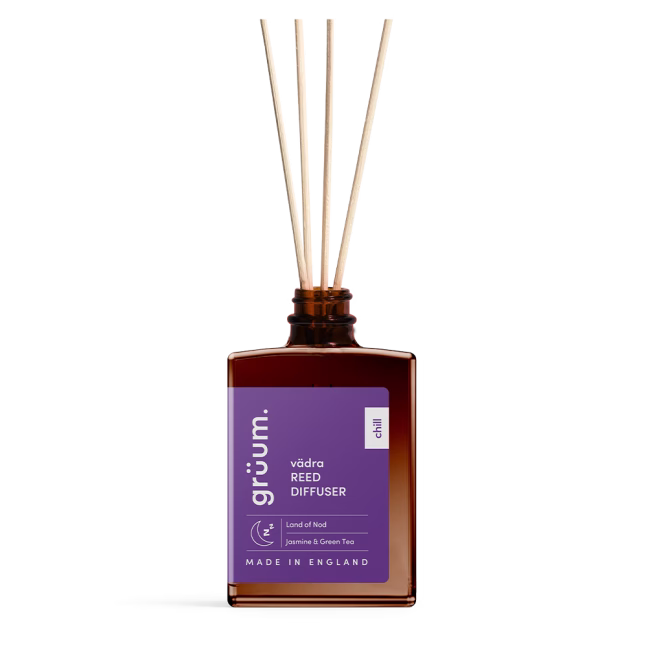 Close-up of the vädra The Land of Nod Reed Diffuser bottle showcasing label and amber glass design.