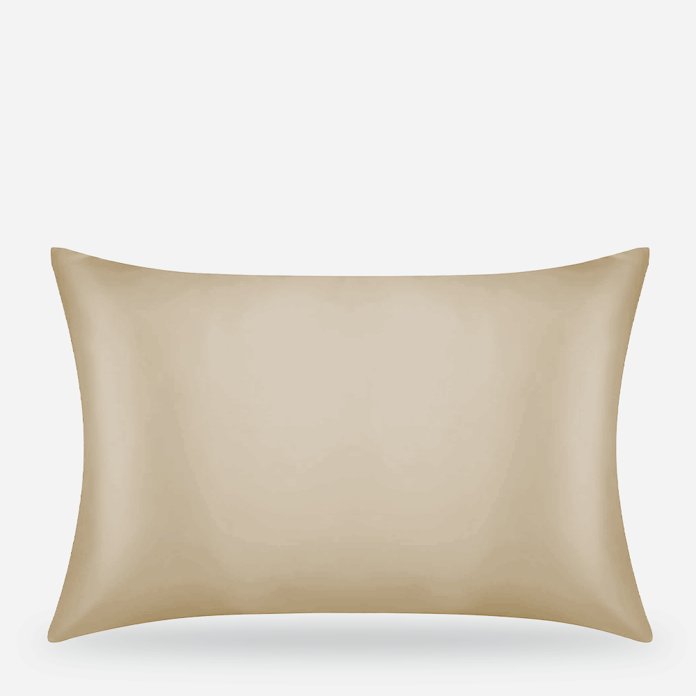 Beige pillow on white background.