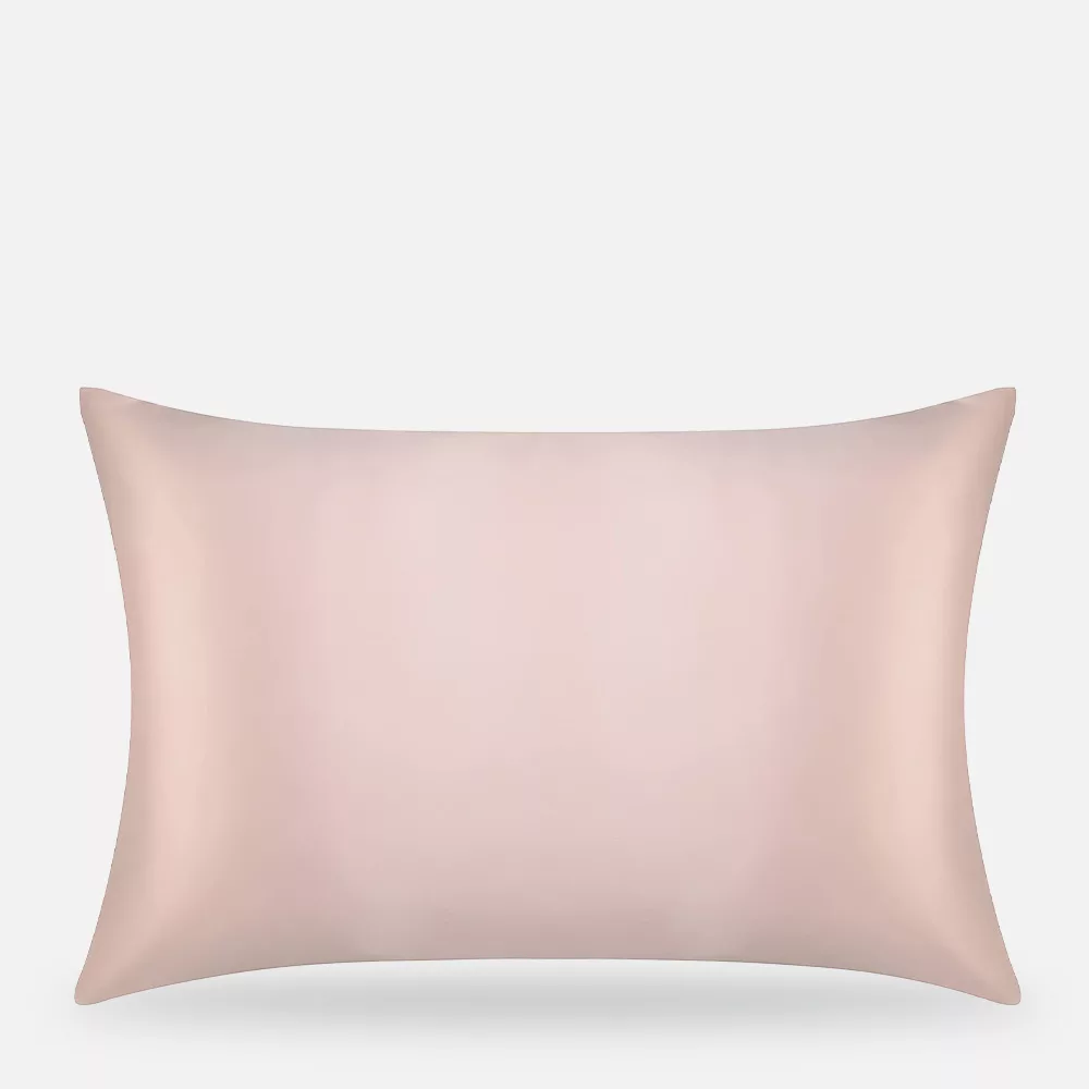 Pink pillow on white background.