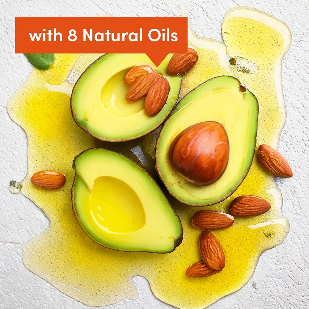 Avocado halves with almonds and oil.