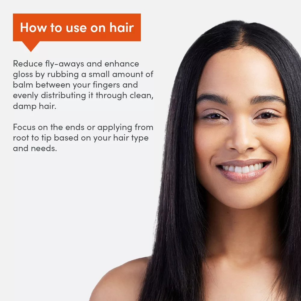 Woman smiling beside hair care instructions.